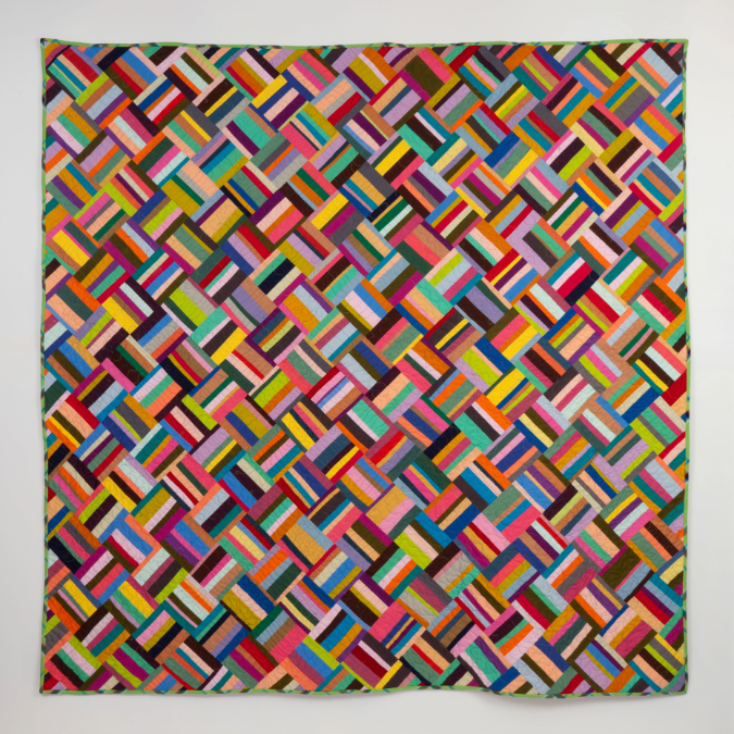 Quilt donated by 84X84" Quilt by artist Susie Brandt.